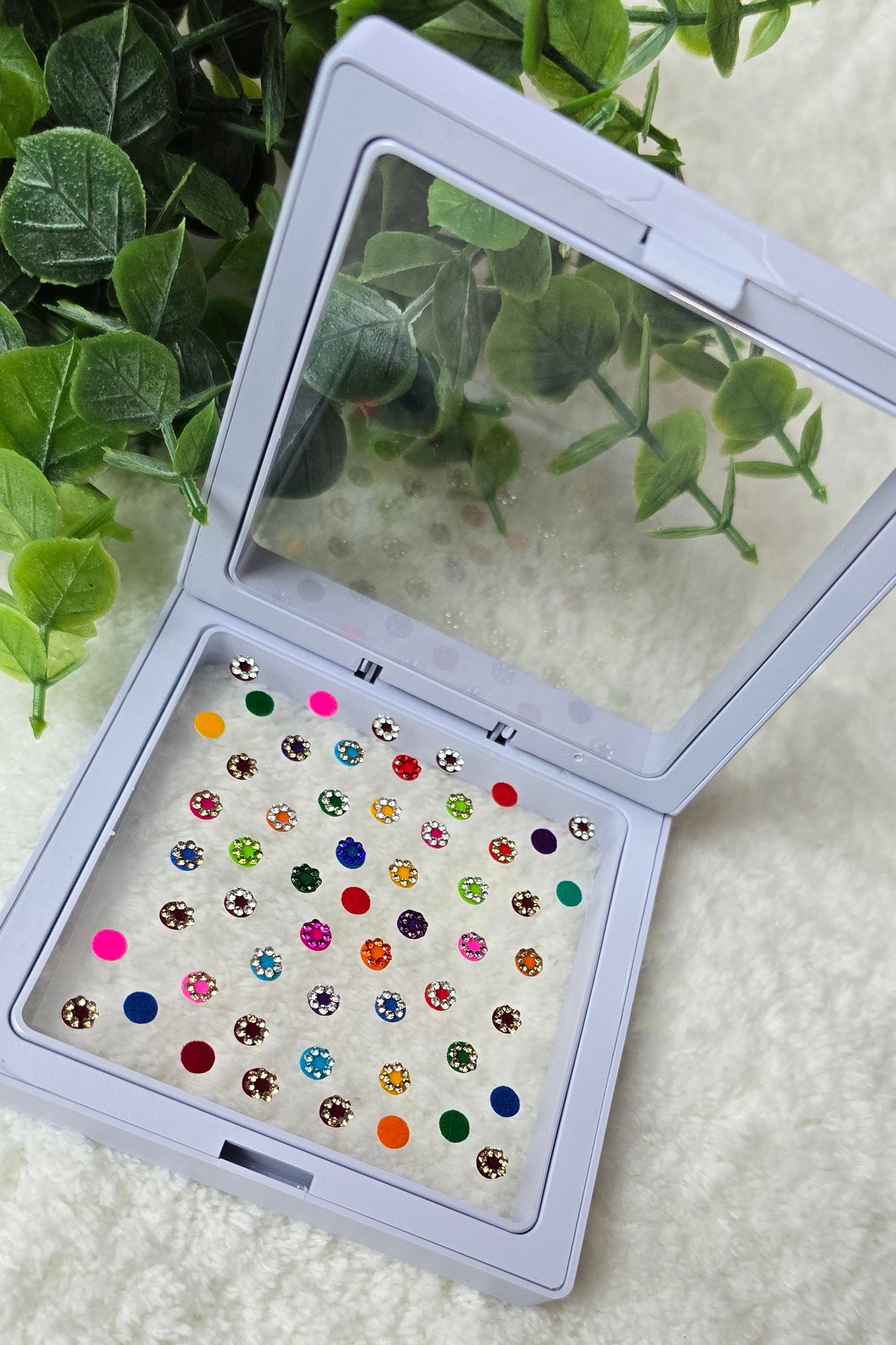 Sun - Rose 50 count multi color and multi design Bindi in see through Box.