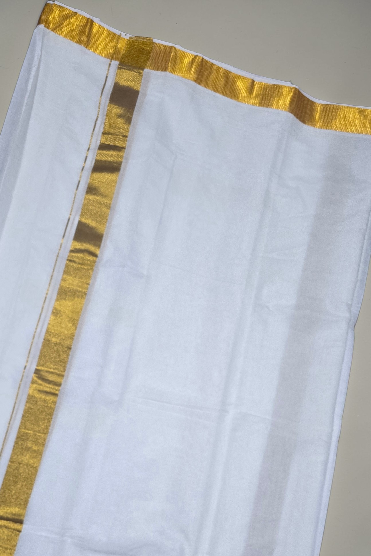 Pure cotton broad golden zari weave Angavastram and Vesti set for Men in White. (D8). Length - 7 Meters.
