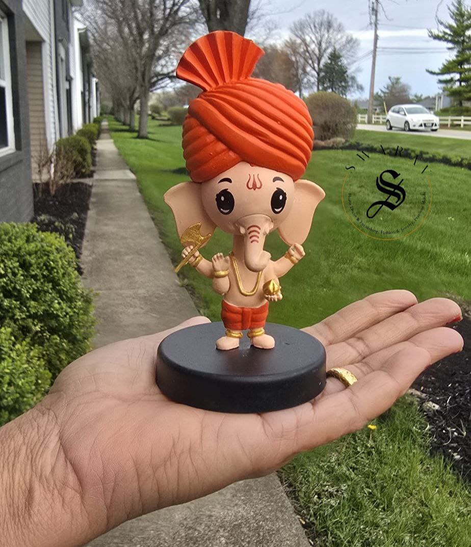 Car Dashboard Accessories - miniature Ganesha with bobblehead.
