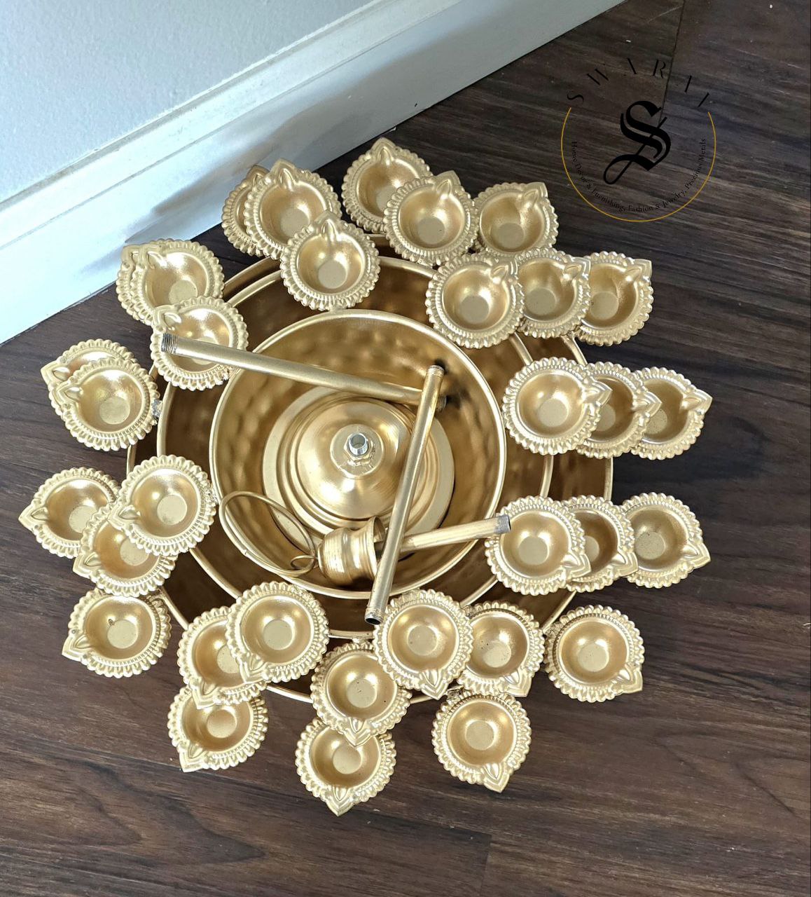 3 Tier Metal hand hammered Diya Urli in gold finish. 30 inch height.