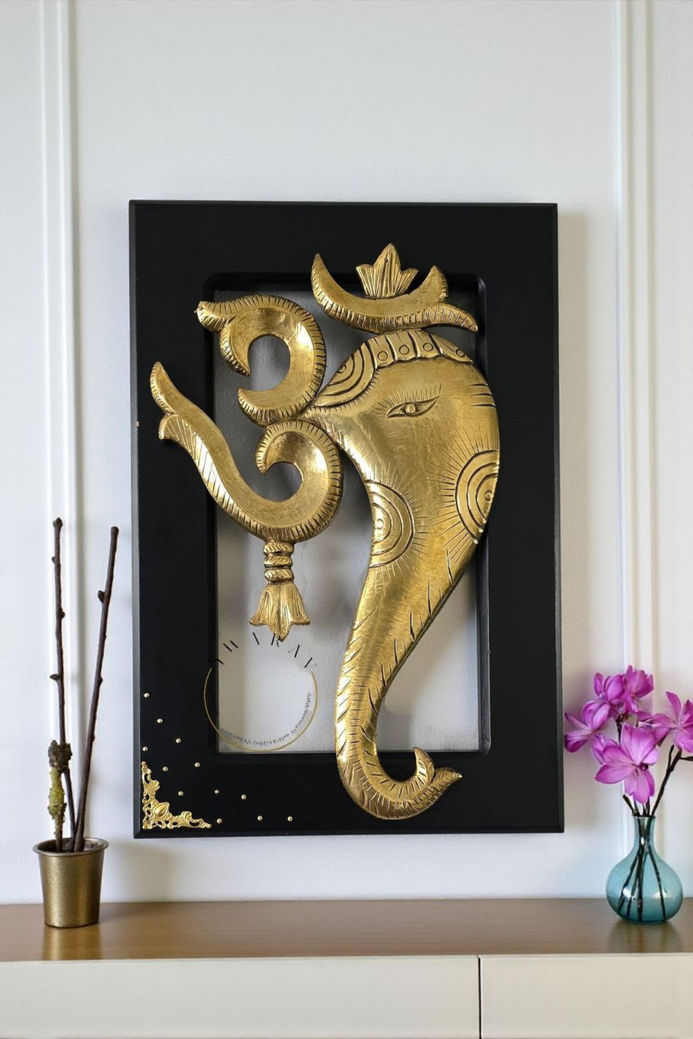 Brass sheet cladding on wood carved Om ganesha figurines. Size 18 by 12 inch. Framed for wall mounting.