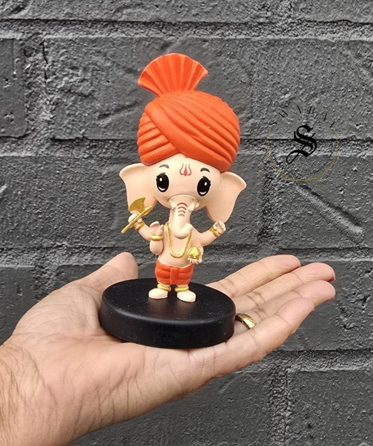 Car Dashboard Accessories - miniature Ganesha with bobblehead.