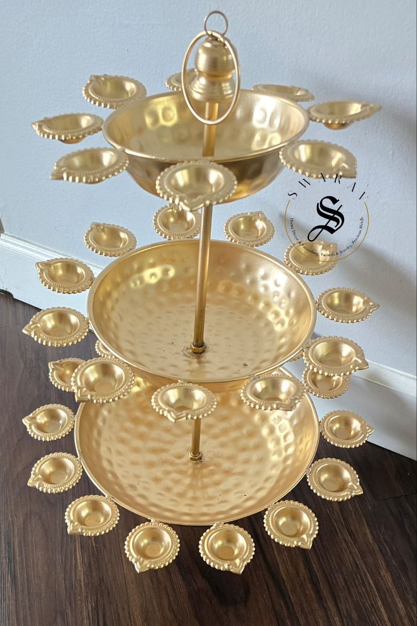 3 Tier Metal hand hammered Diya Urli in gold finish. 30 inch height.