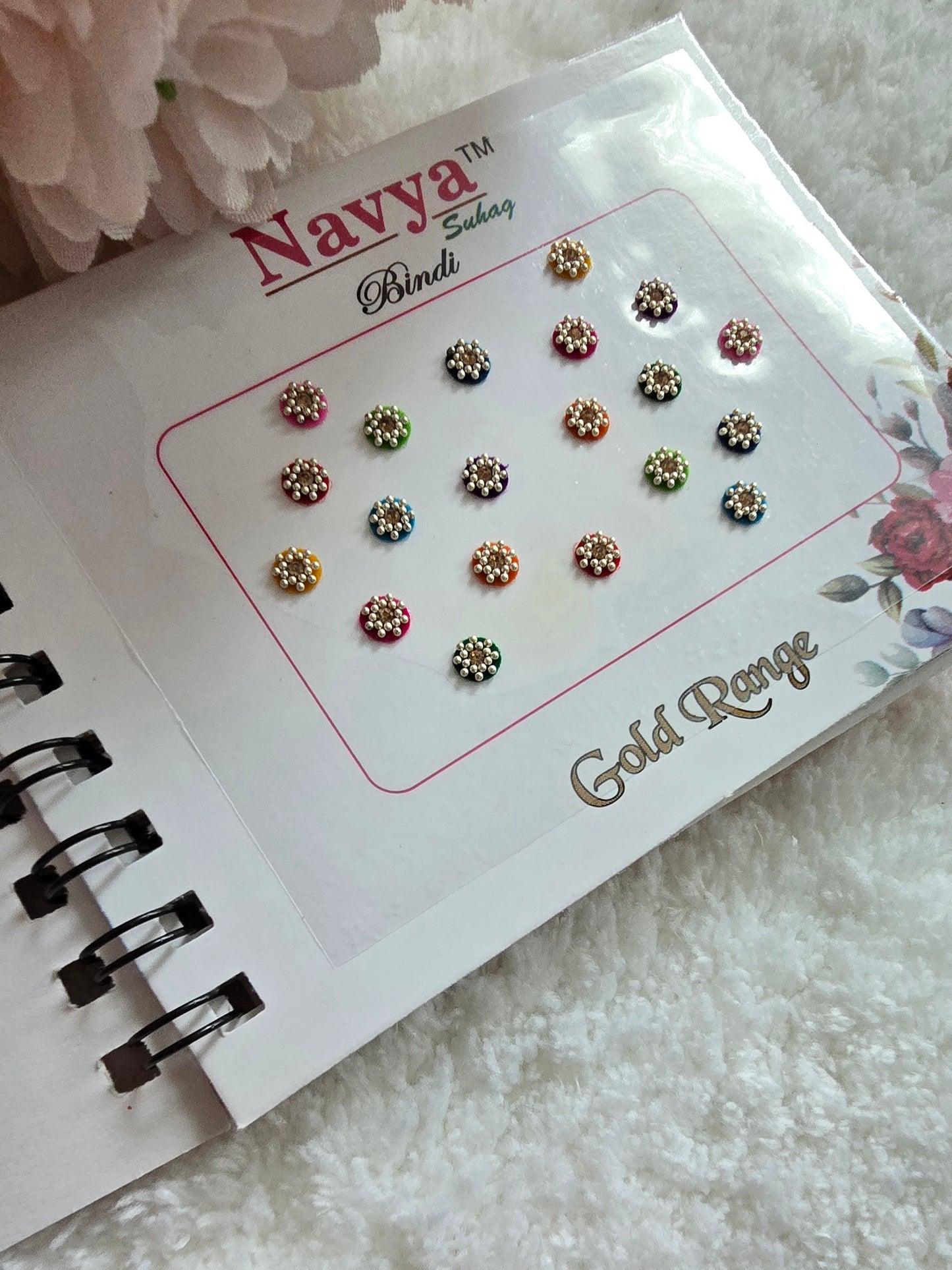 Pack of 4 - Navya multi-colored pocket size party wear fancy stone studded spiral Bindi book.