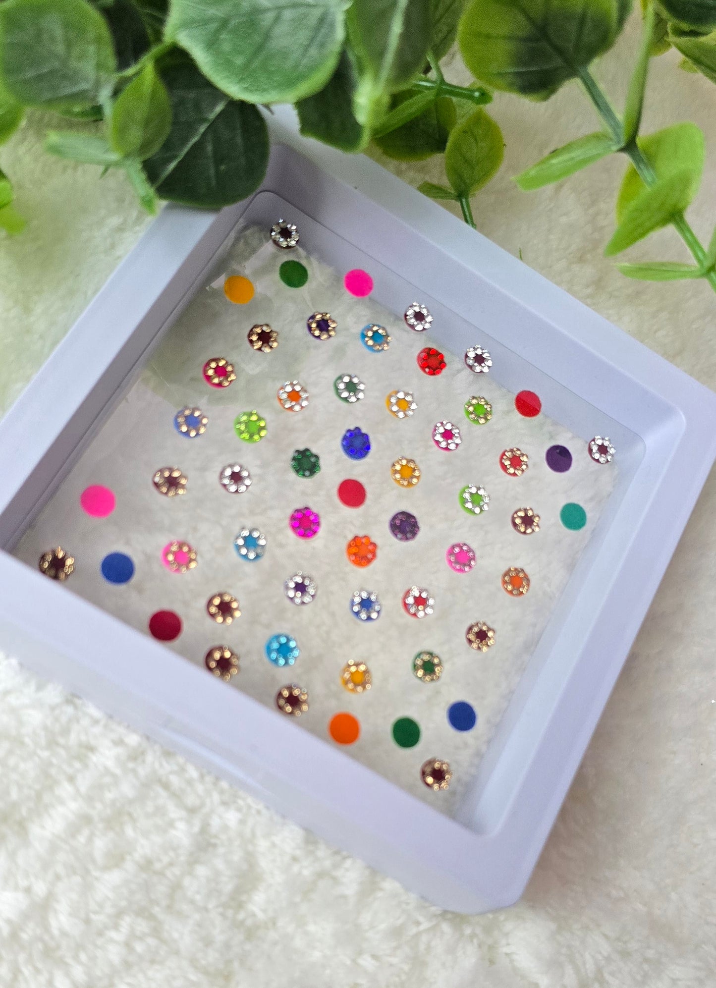 Sun - Rose 50 count multi color and multi design Bindi in see through Box.