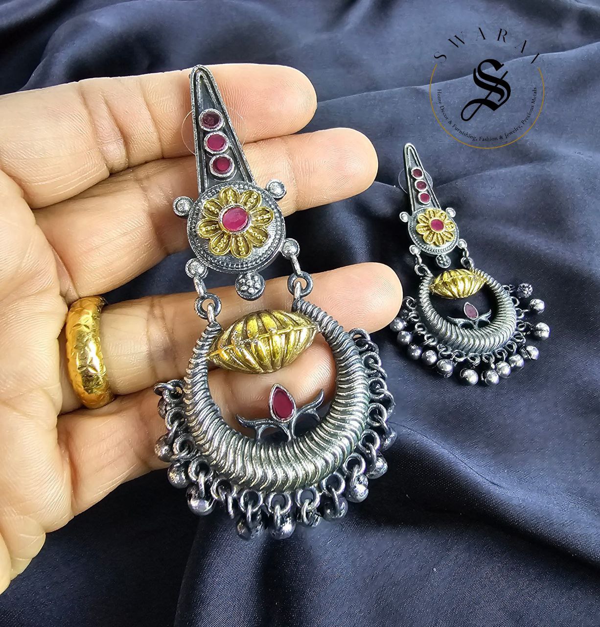 Oxidized pink stone studded earrings in Sankh Chakra and Nama style.