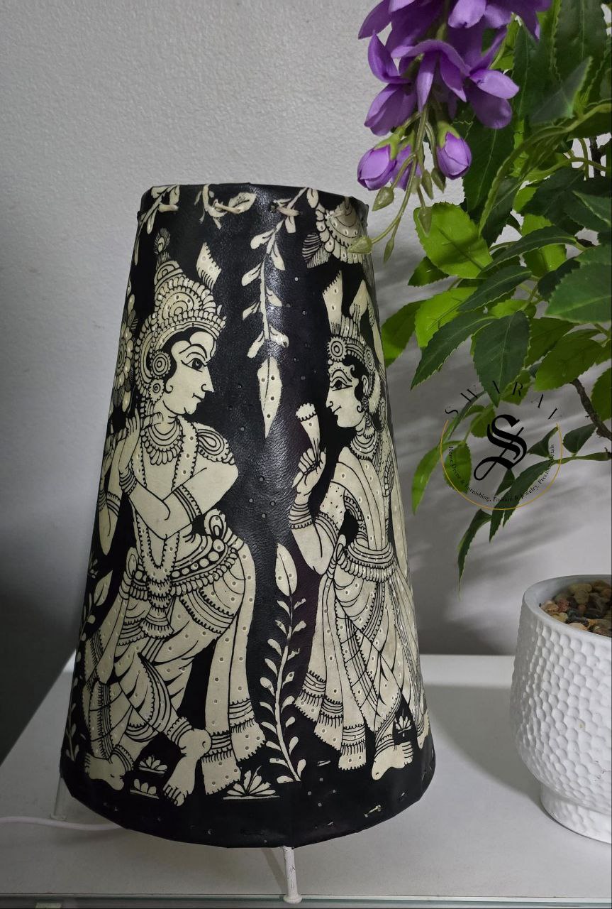 Black and white Hand-made leather lamp shade with hand painted theme of Radha- Krishna. Size - 12 inch.