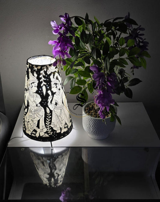 Black and white Hand-made leather lamp shade with hand painted theme of Radha- Krishna. Size - 12 inch.