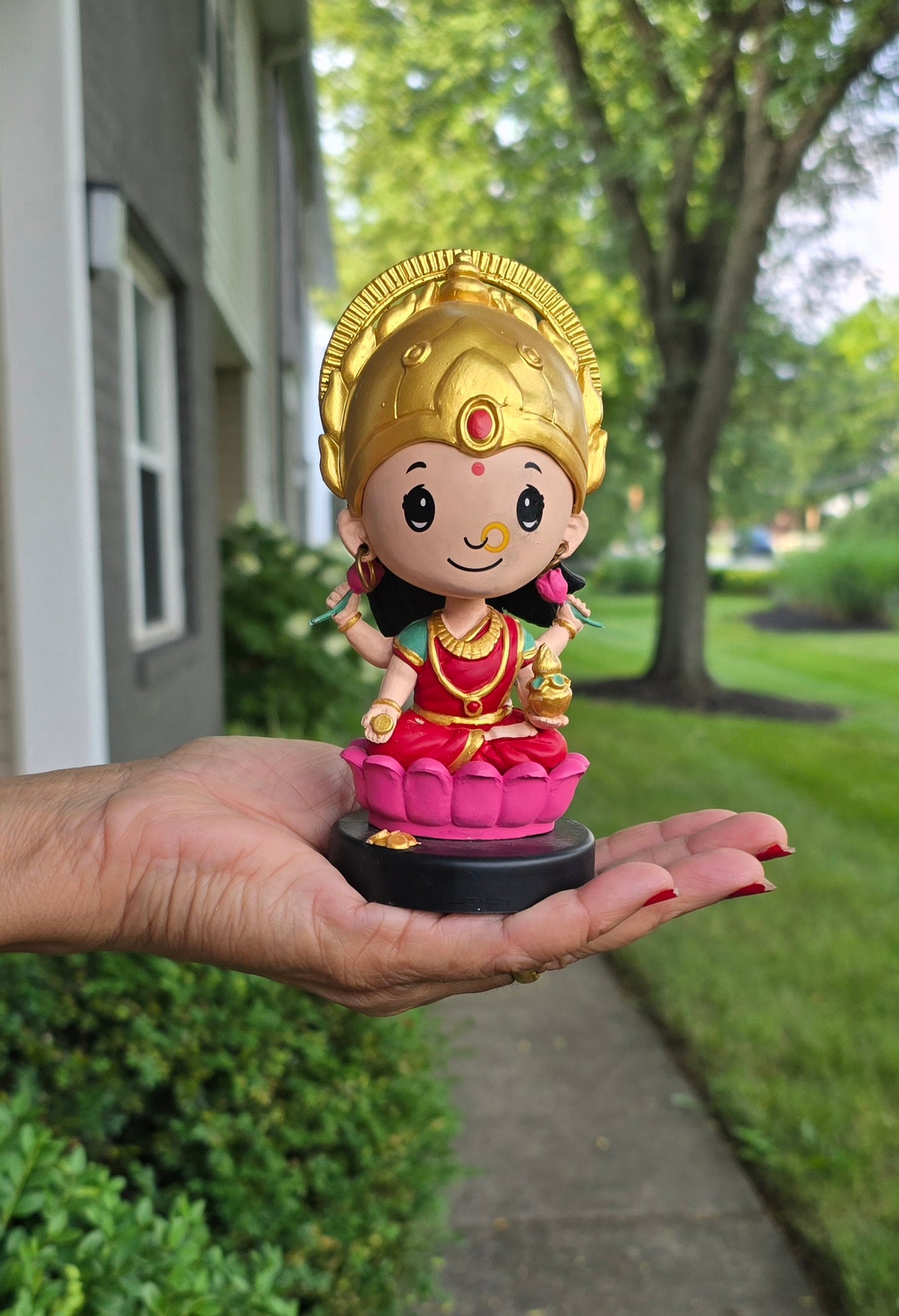 Car Dashboard Accessories - miniature Lakshmi with bobblehead.