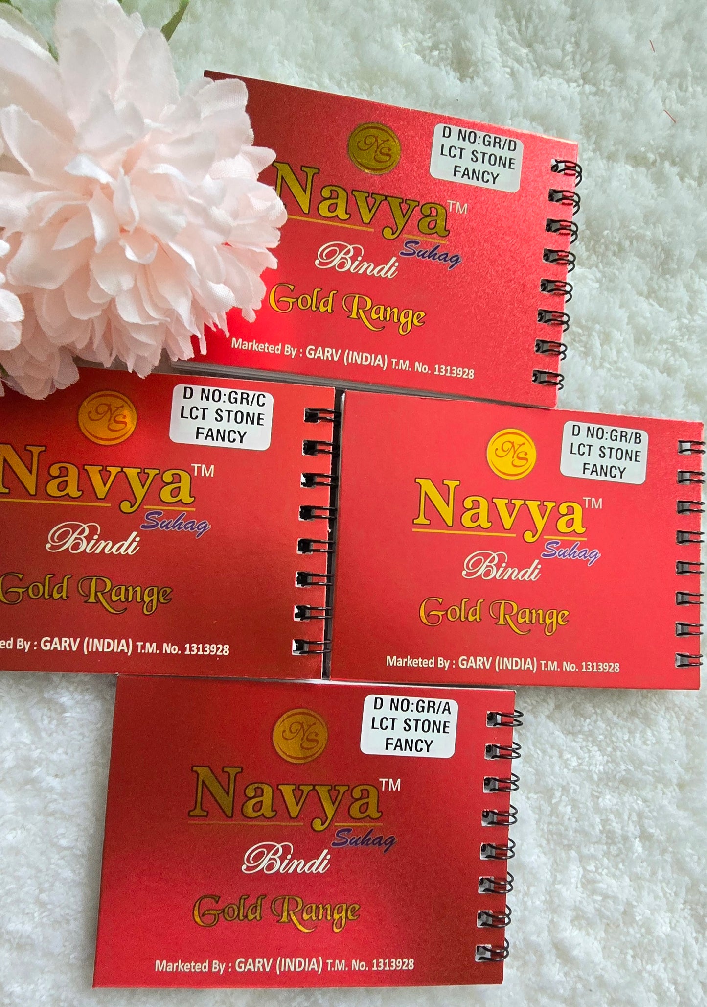 Pack of 4 - Navya multi-colored pocket size party wear fancy stone studded spiral Bindi book.