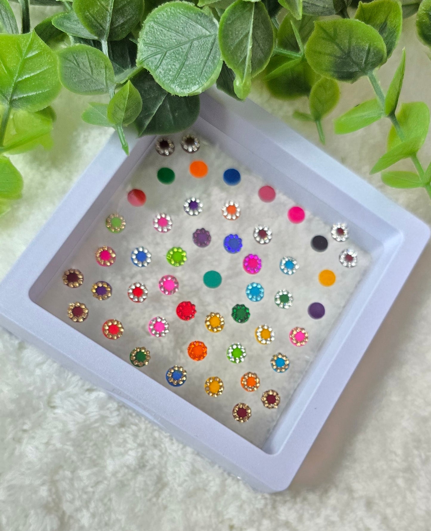 Sun - Rose 50 count multi color and multi design Bindi in see through Box.