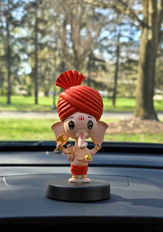 Car Dashboard Accessories - miniature Ganesha with bobblehead.