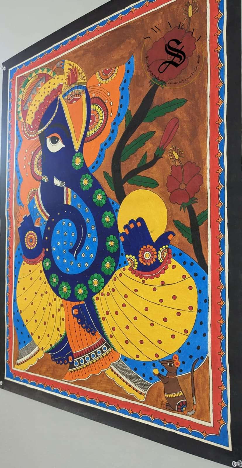 Madhubani or Mithila Painting – Lord Ganesha with his beautiful ornaments and Laddu in hand.