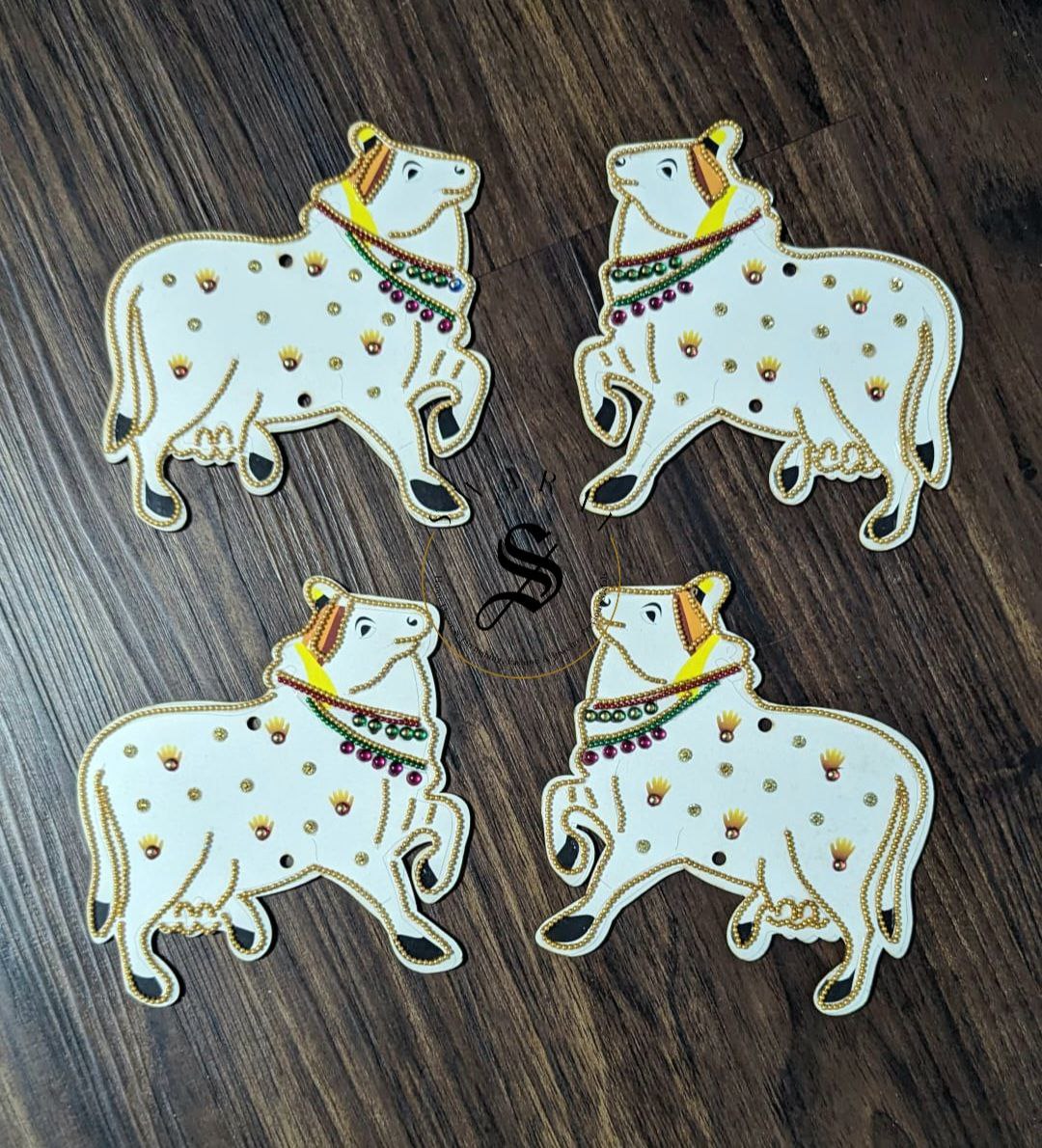 Set of 4 - MDF cut Cow décor with sequence and stone work.