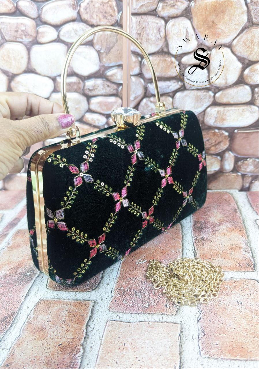 Sequence and embroidered Party Clutch - Size : 9 by 5 by 2 inches. Color - Leather Black.