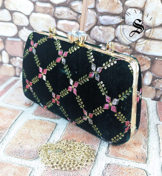 Sequence and embroidered Party Clutch - Size : 9 by 5 by 2 inches. Color - Leather Black.