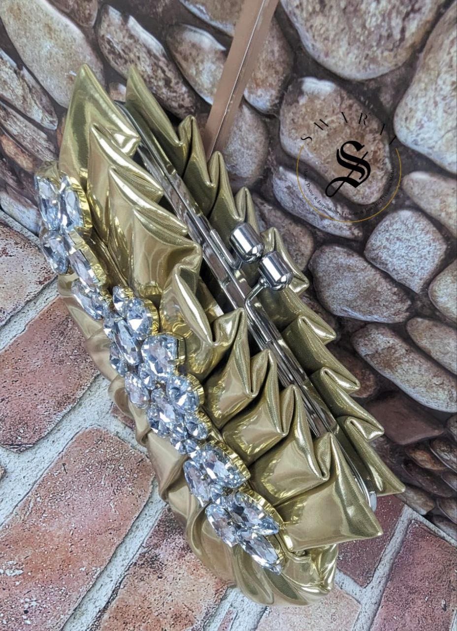 Women's Pleated crystal stone broach Party clutch. Size - 9 by 5 inch. Color - Golden.