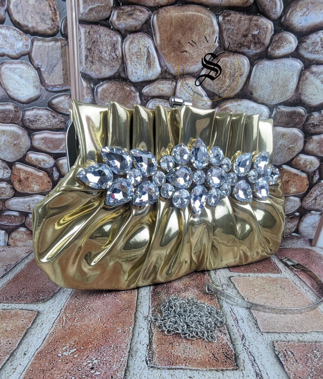 Women's Pleated crystal stone broach Party clutch. Size - 9 by 5 inch. Color - Golden.