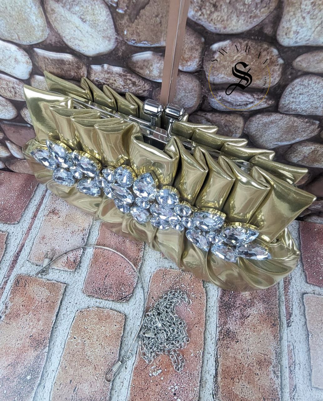 Women's Pleated crystal stone broach Party clutch. Size - 9 by 5 inch. Color - Golden.