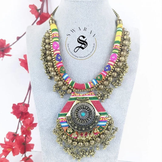 Multi color Fabric Necklace with brass beads and big size pendant.