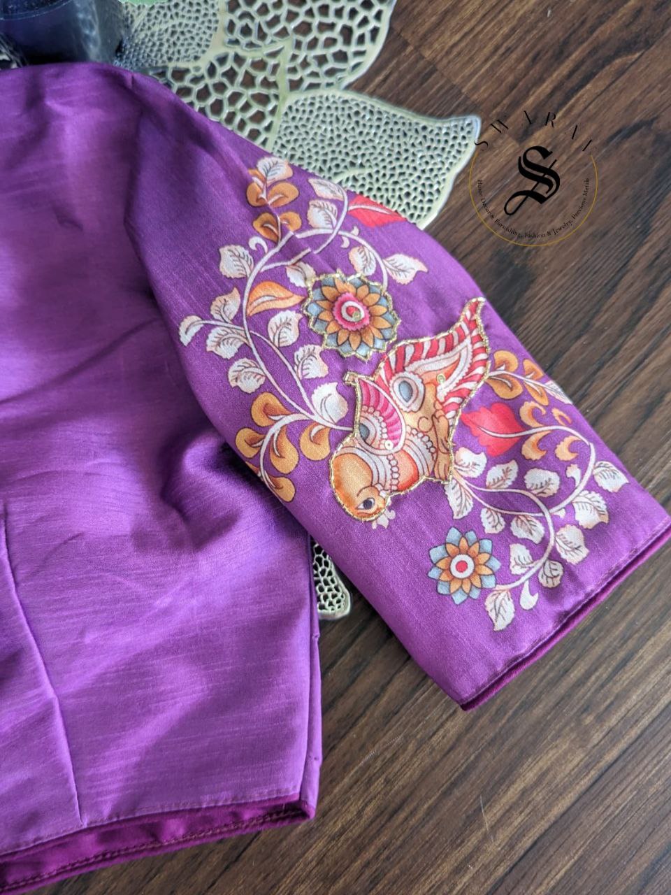 Ready to wear Pure Raw Silk Designer blouse with Pichwai print and beads work. Color - Purple. Size - 38 to 42 inches.