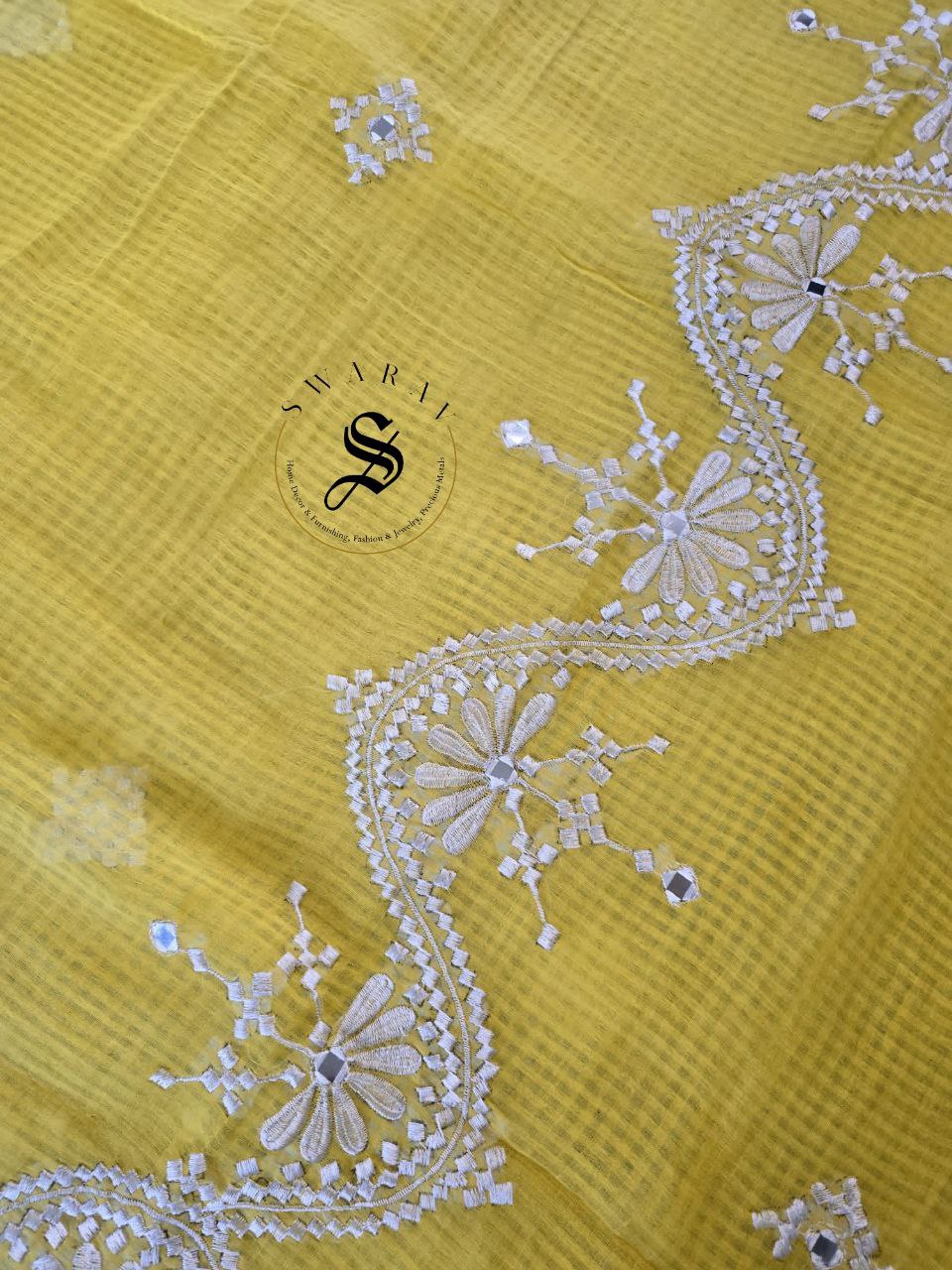 Soft Kota cotton with white thread embroidery and faux mirrors. Color- Yellow.