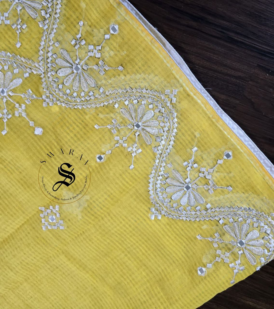 Soft Kota cotton with white thread embroidery and faux mirrors. Color- Yellow.