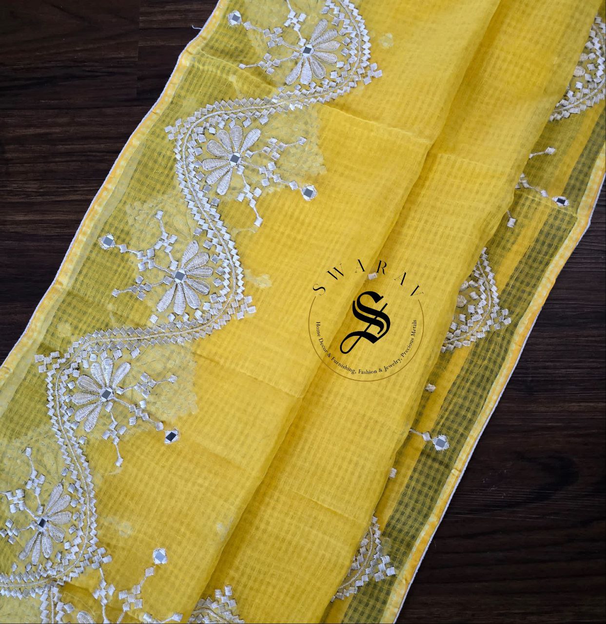 Soft Kota cotton with white thread embroidery and faux mirrors. Color- Yellow.