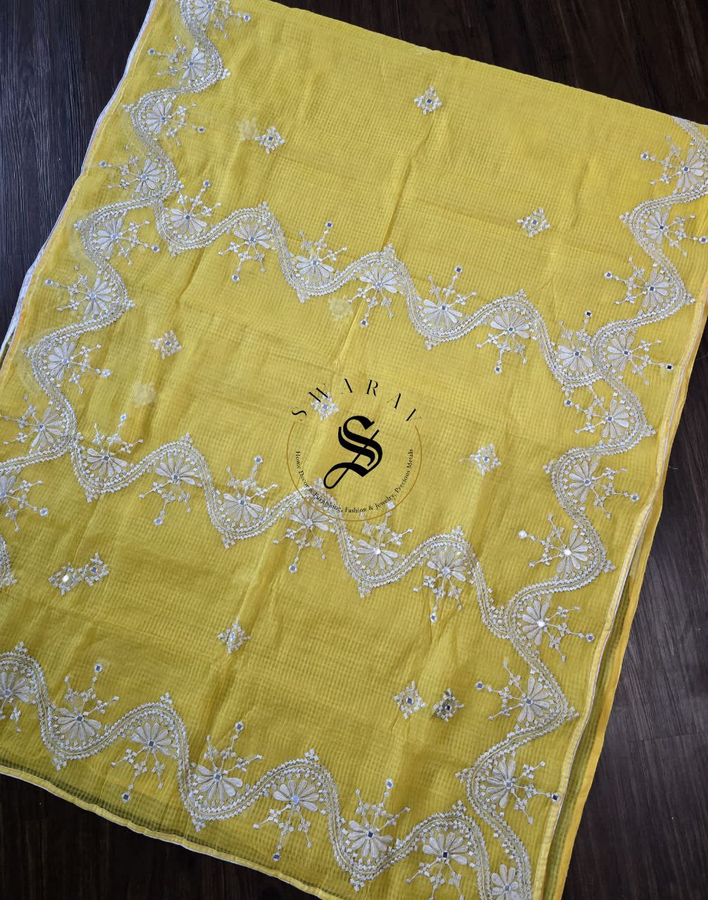 Soft Kota cotton with white thread embroidery and faux mirrors. Color- Yellow.