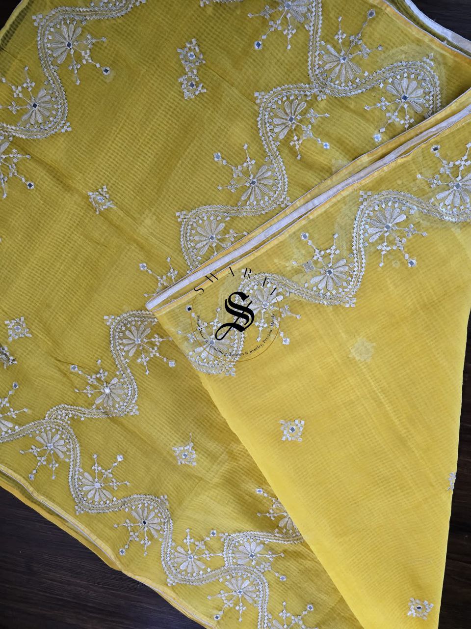 Soft Kota cotton with white thread embroidery and faux mirrors. Color- Yellow.