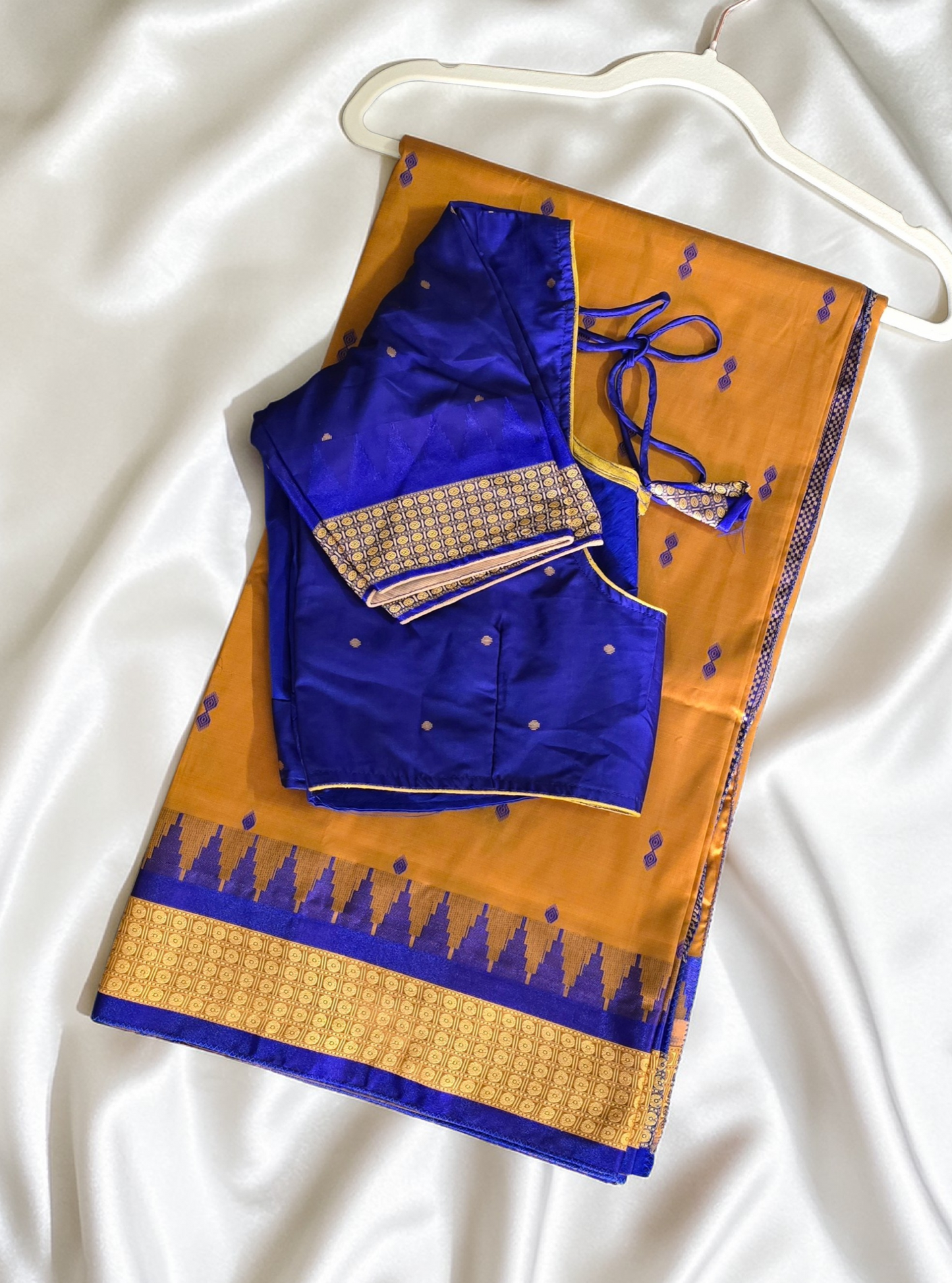 Mustard/turmeric yellow Sambalpuri Bomkai silk saree with royal blue stitched blouse. Code - SAR103