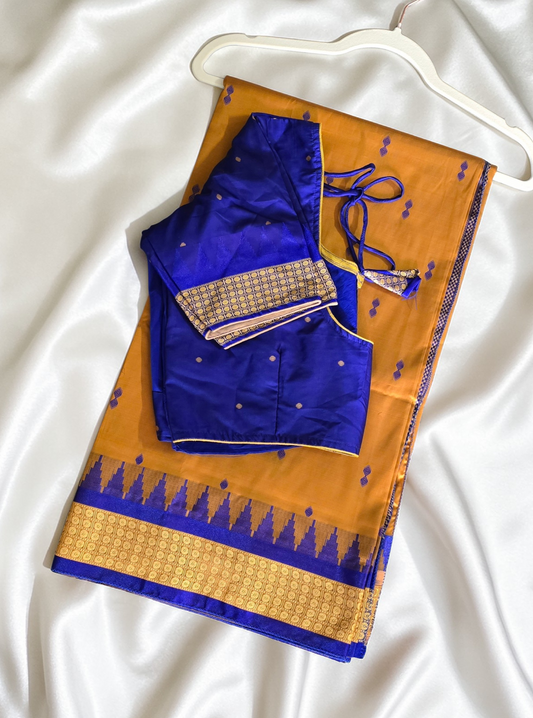 Mustard/turmeric yellow Sambalpuri Bomkai silk saree with royal blue stitched blouse. Code - SAR103