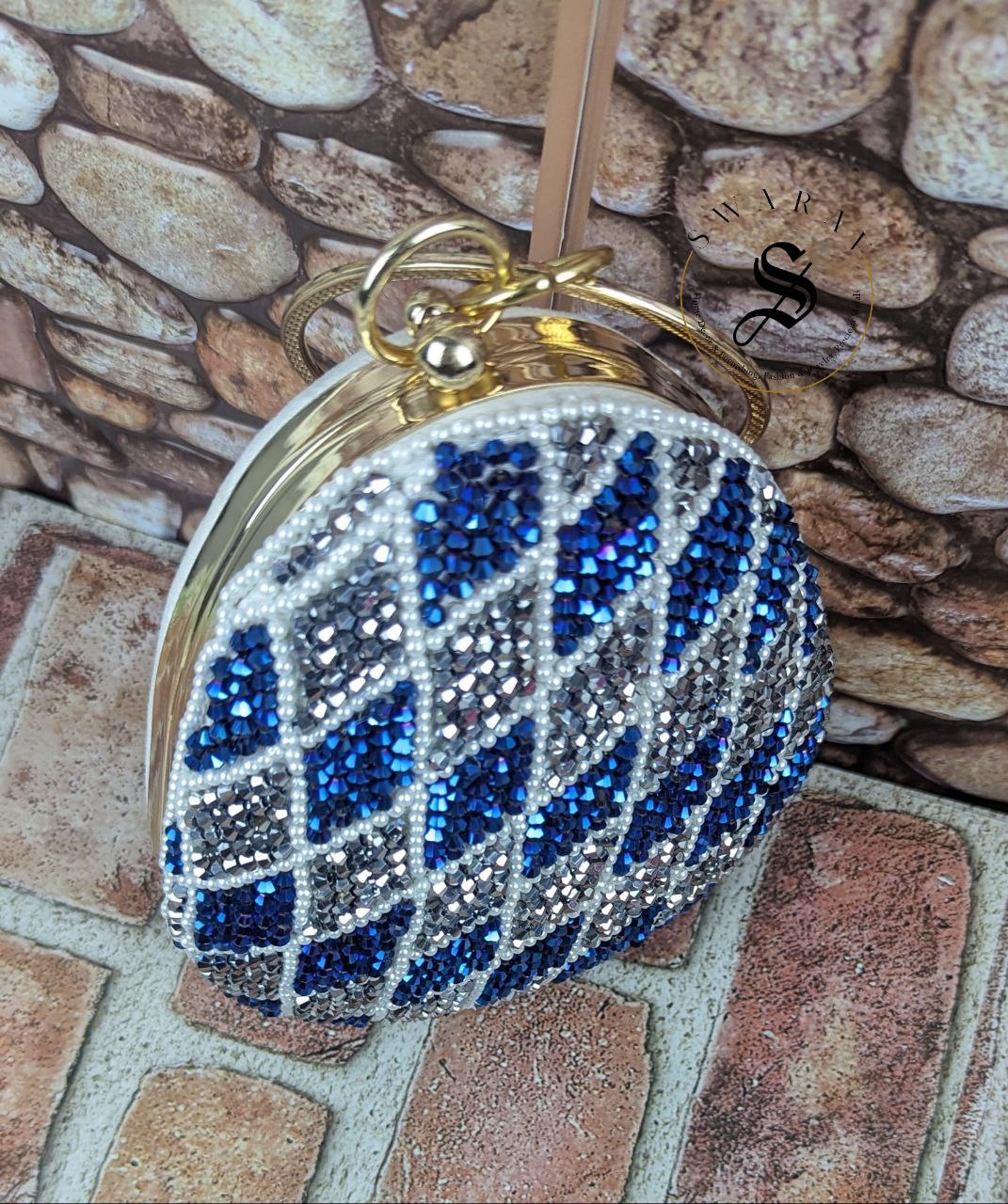 Coconut shape party clutch with Peacock Blue and Silver crystal Beads.