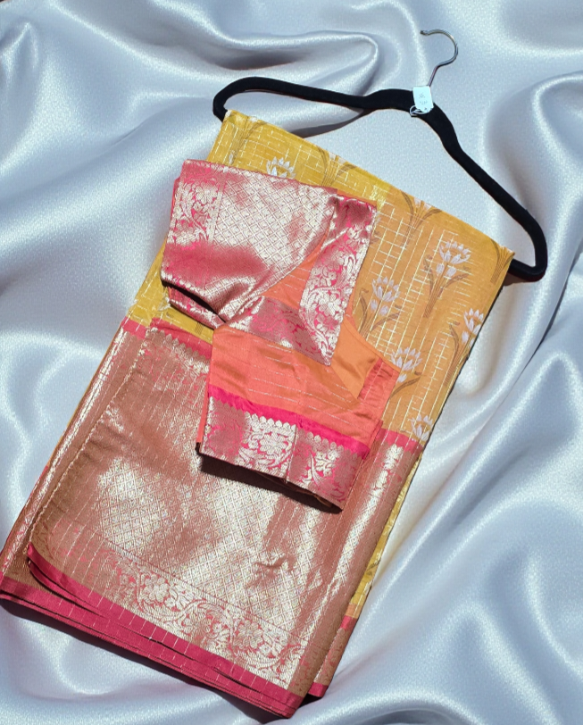 Organza floral silk saree with zari weave kanchi style skirt border and stitched blouse.