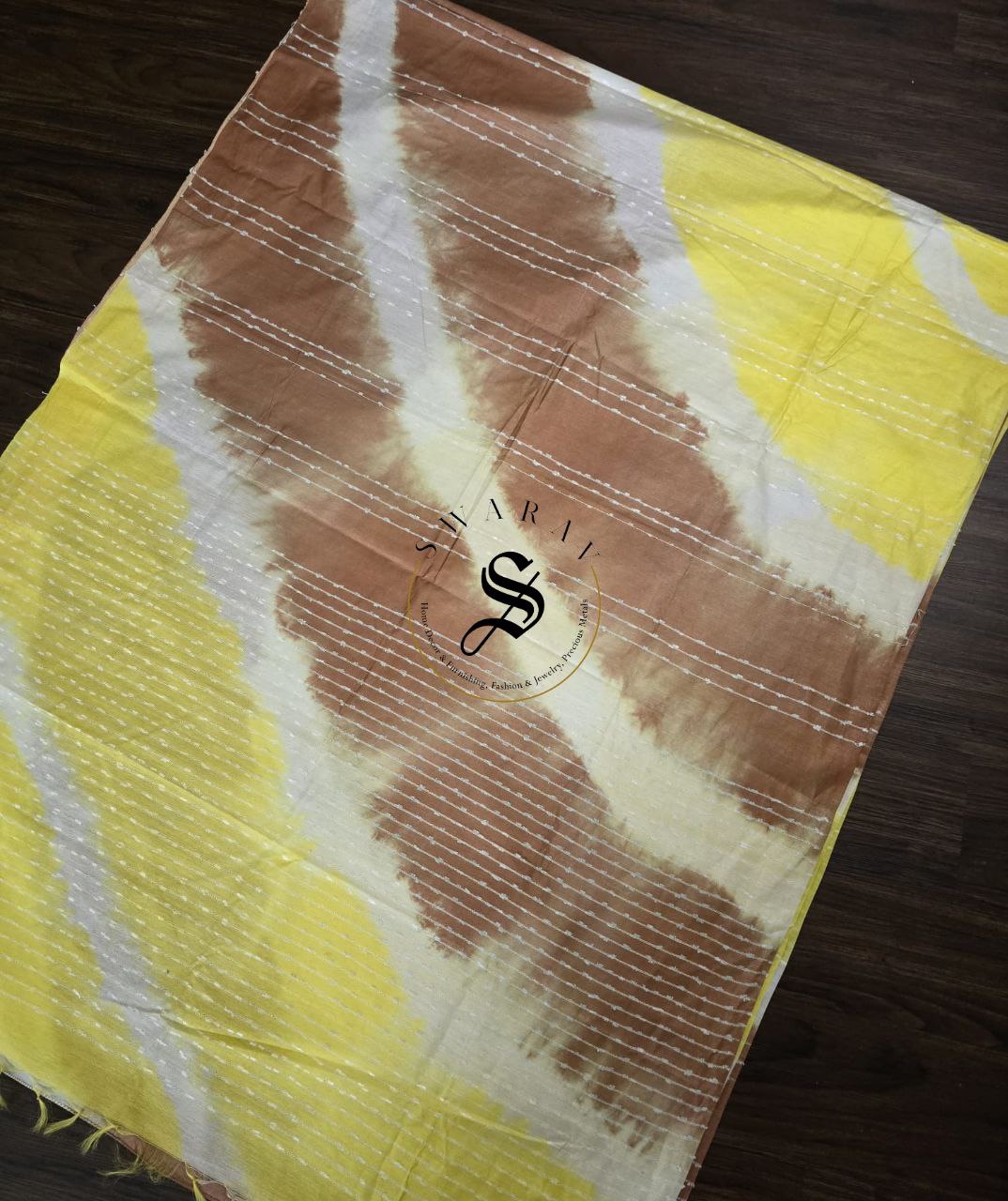 Semi Tussar hand shibori saree with stitched blouse. Color - yellow and brown