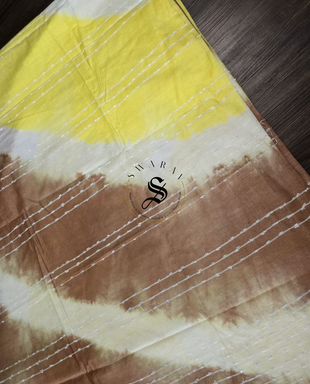 Semi Tussar hand shibori saree with stitched blouse. Color - yellow and brown