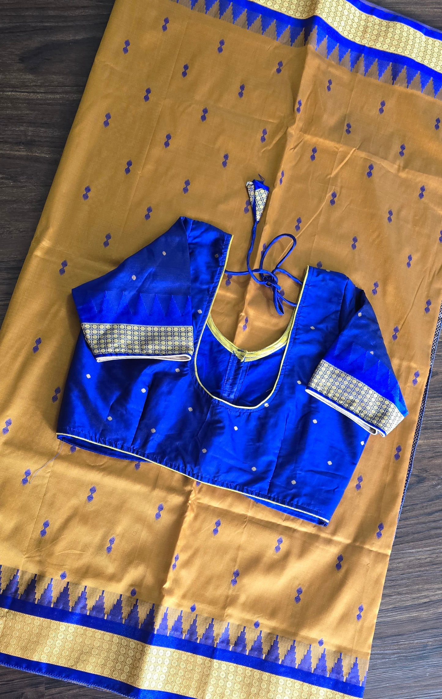 Mustard/turmeric yellow Sambalpuri Bomkai silk saree with royal blue stitched blouse. Code - SAR103