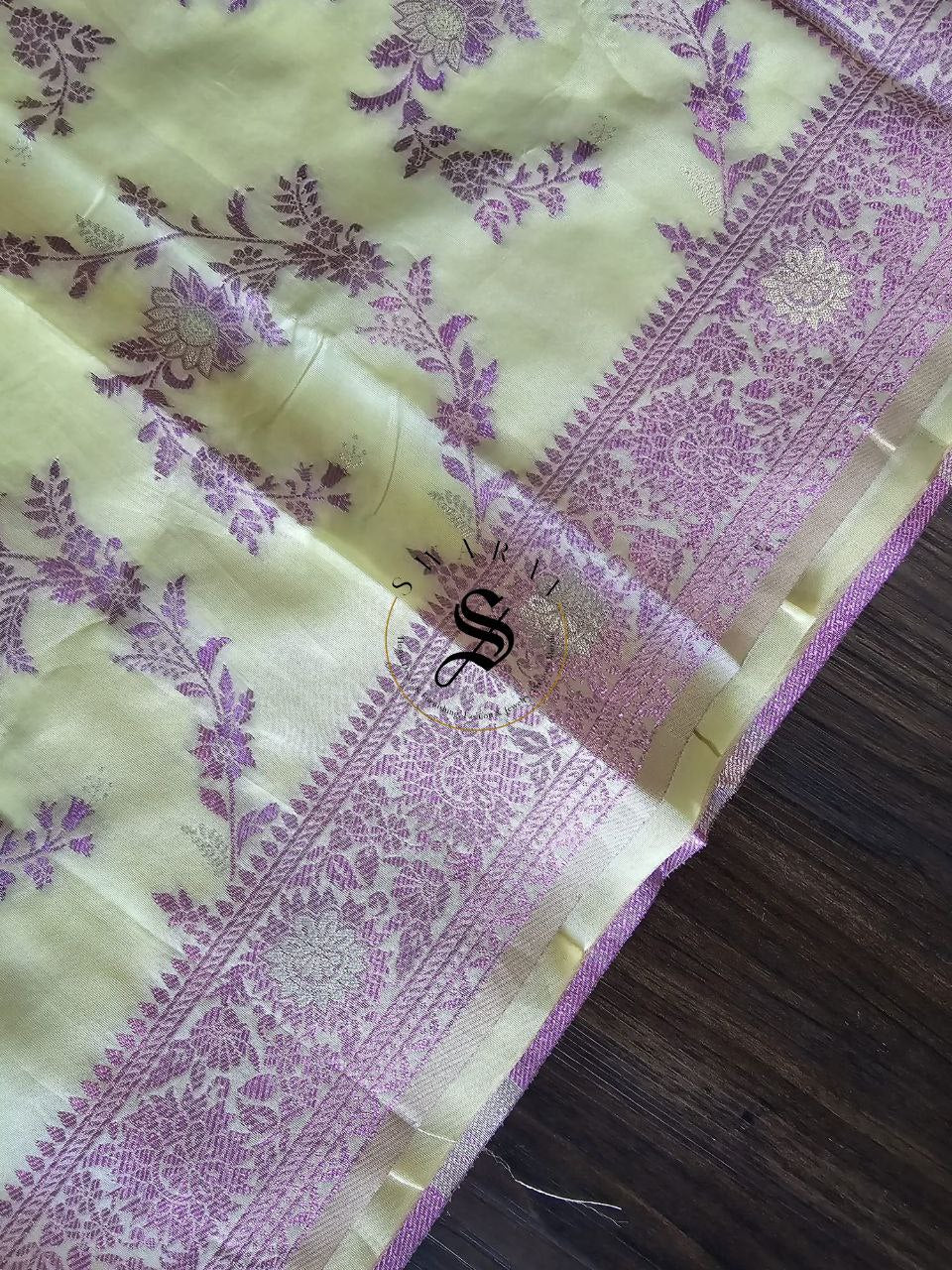 Organza Banarasi Saree with FREE ready to wear Blouse. Color - Pastel Yellow with shiny purple zari work all over.