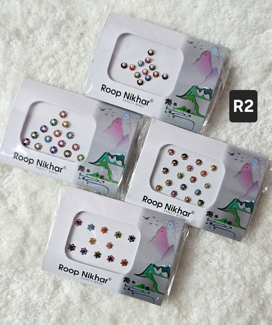RoopNikhar pack of 4 fancy bindi . Round shape , multicolor.