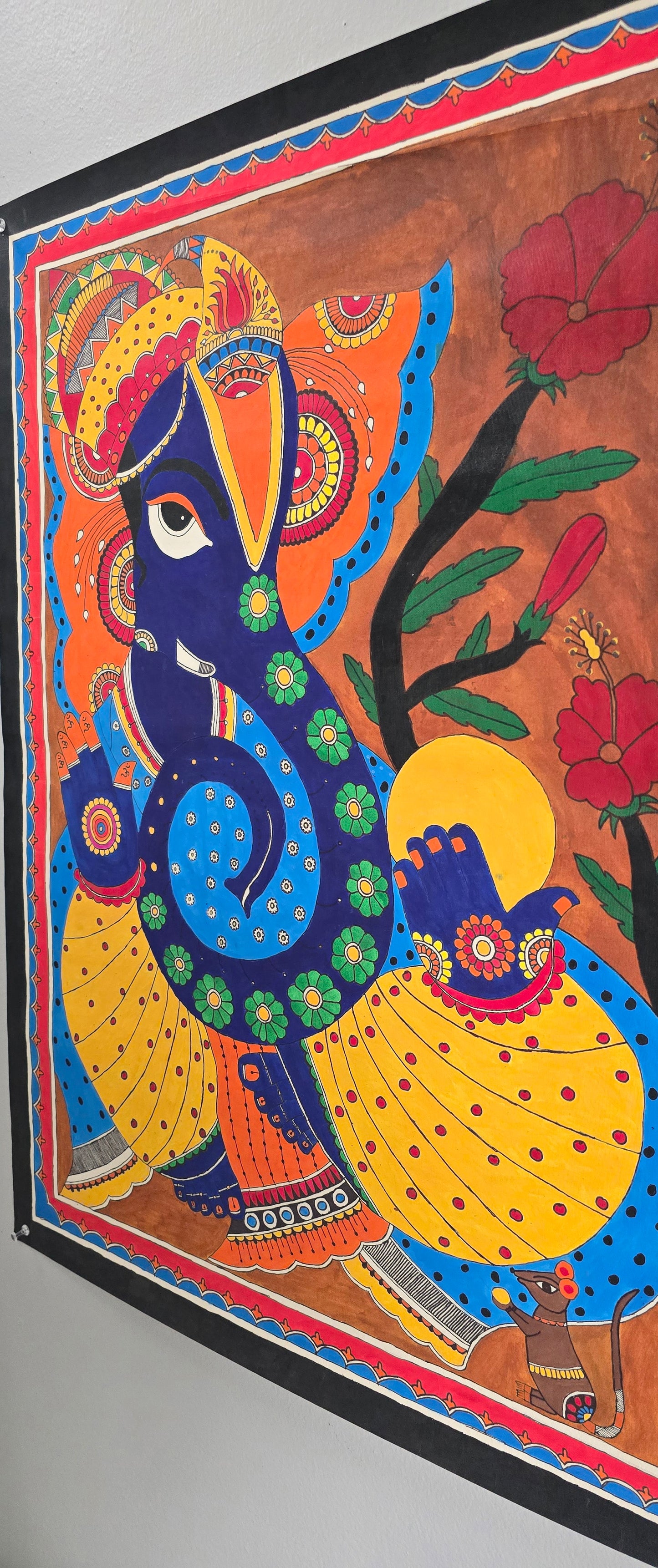 Madhubani or Mithila Painting – Lord Ganesha with his beautiful ornaments and Laddu in hand.
