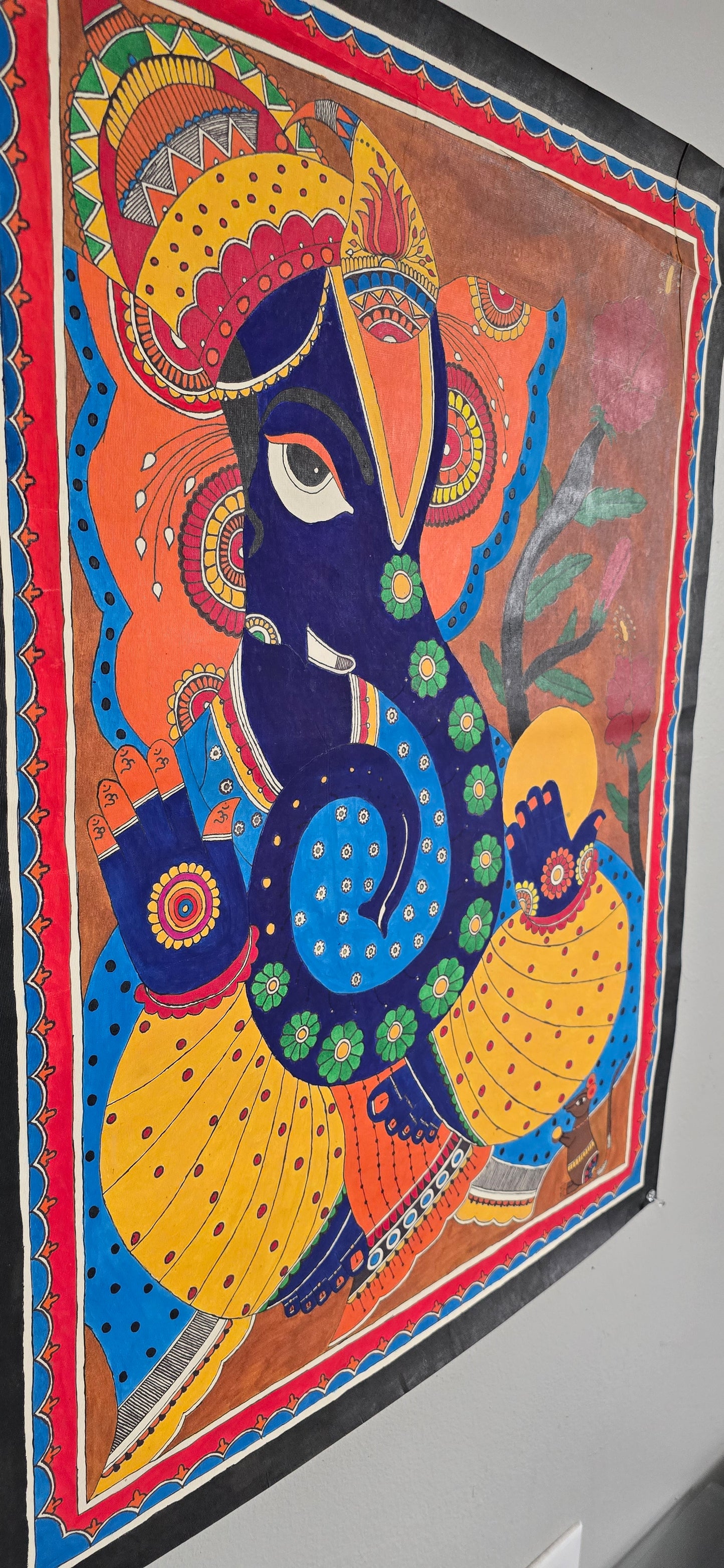 Madhubani or Mithila Painting – Lord Ganesha with his beautiful ornaments and Laddu in hand.