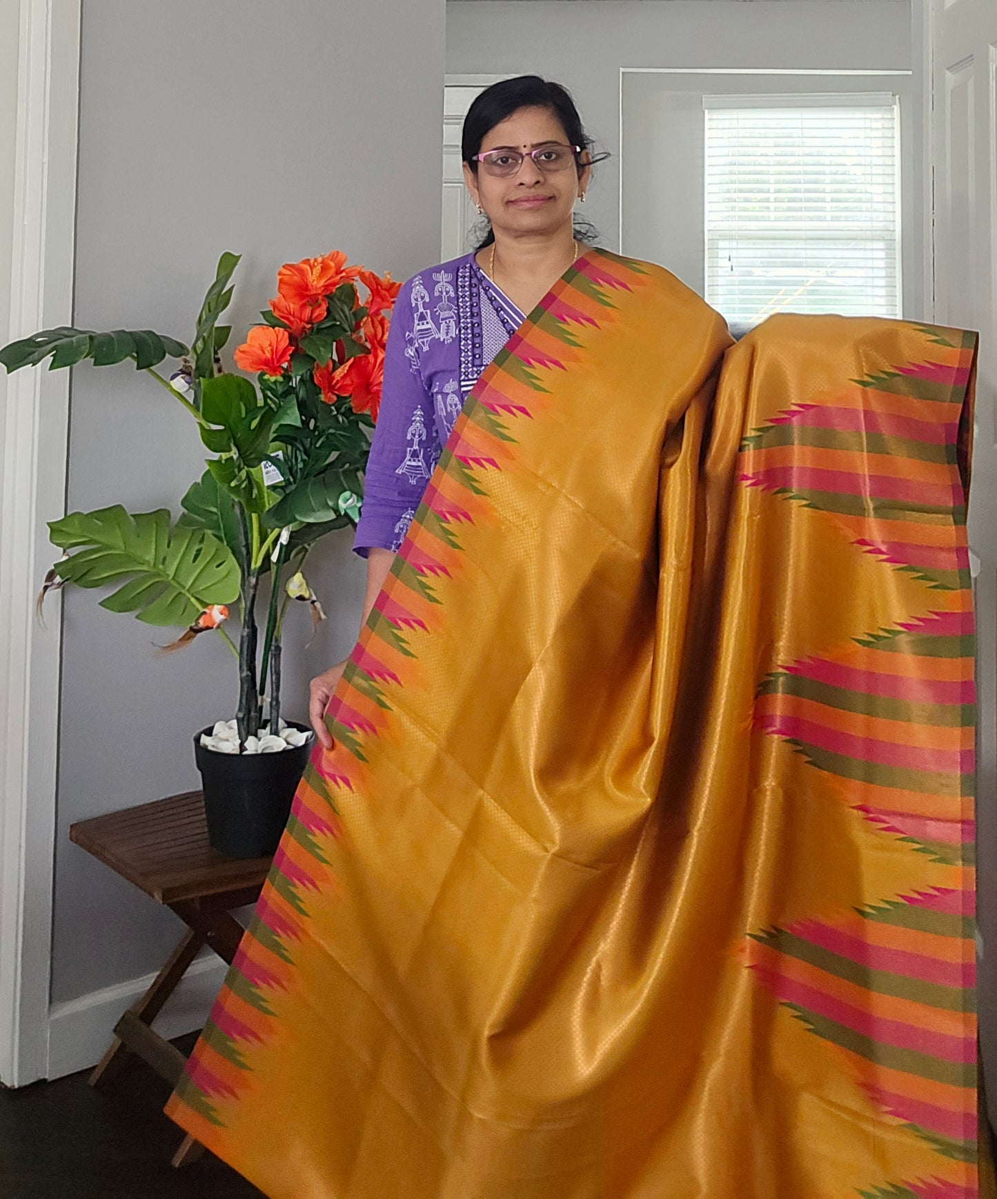 Golden yellow temple border semi silk saree with majenta Jacquard stitched blouse. Code - SAR101