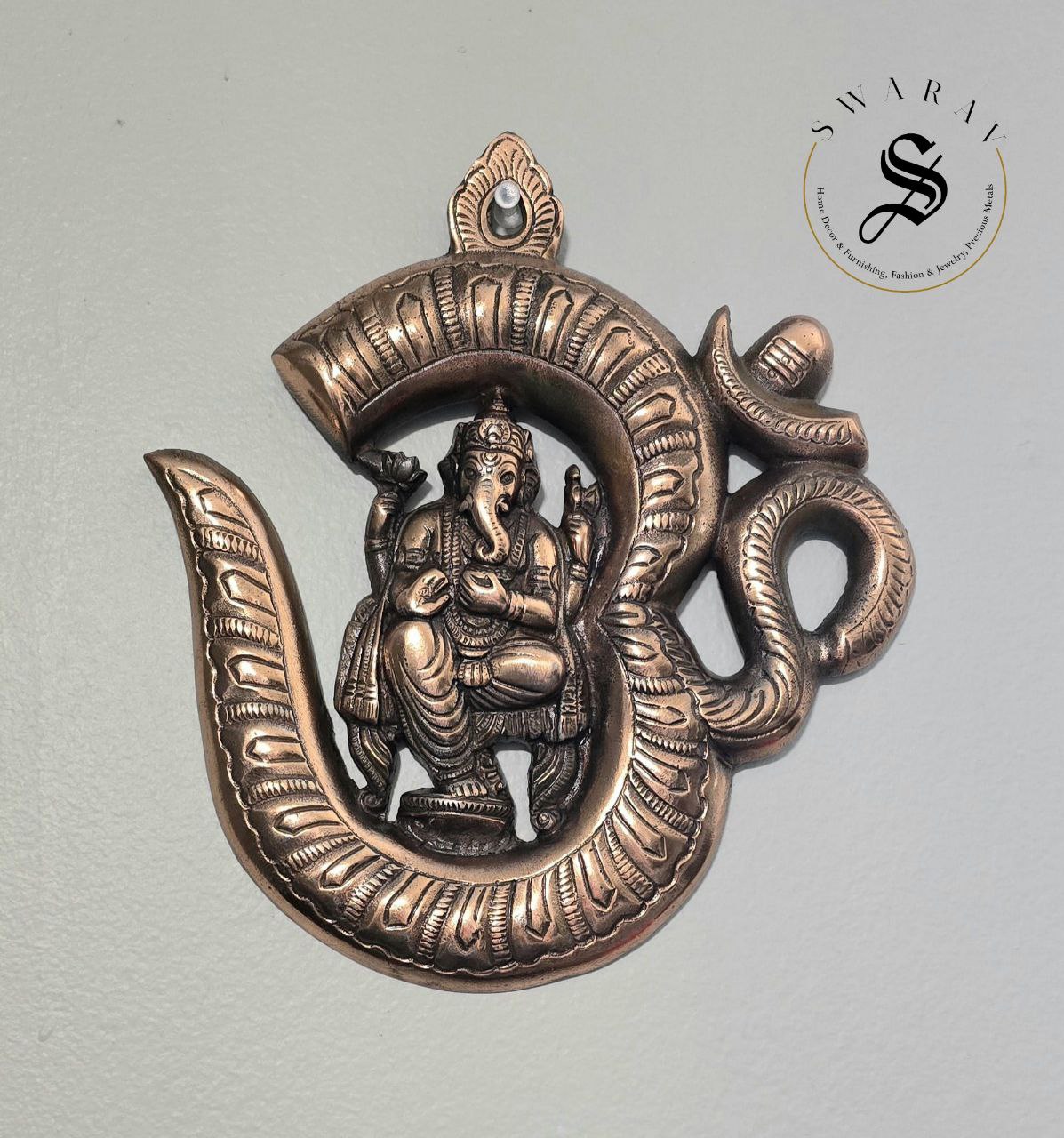 Gun metal ( Black metal/ Red Brass) Om Ganesha wall décor. Size - 9 inch.