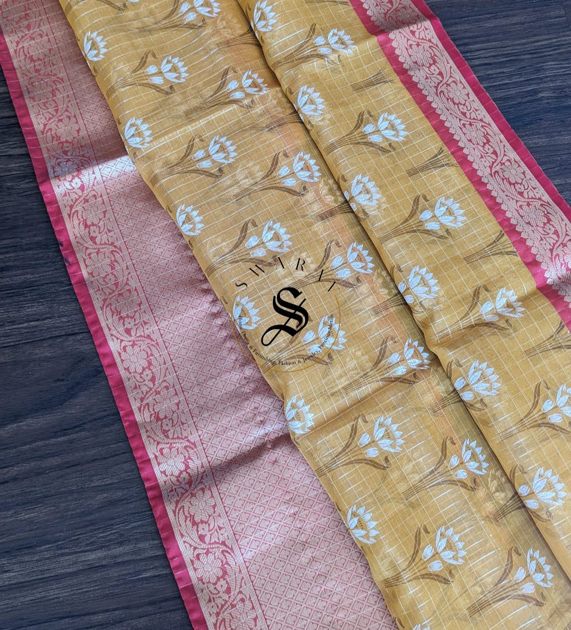 Organza floral silk saree with zari weave kanchi style skirt border and stitched blouse.