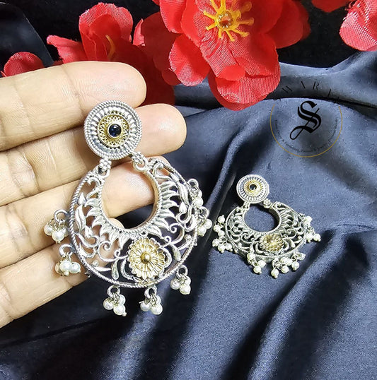 Oxidized handmade earrings with dual tone floral carving. Size - approx 3 inch.