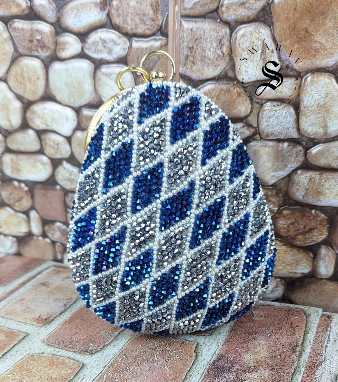 Coconut shape party clutch with Peacock Blue and Silver crystal Beads.