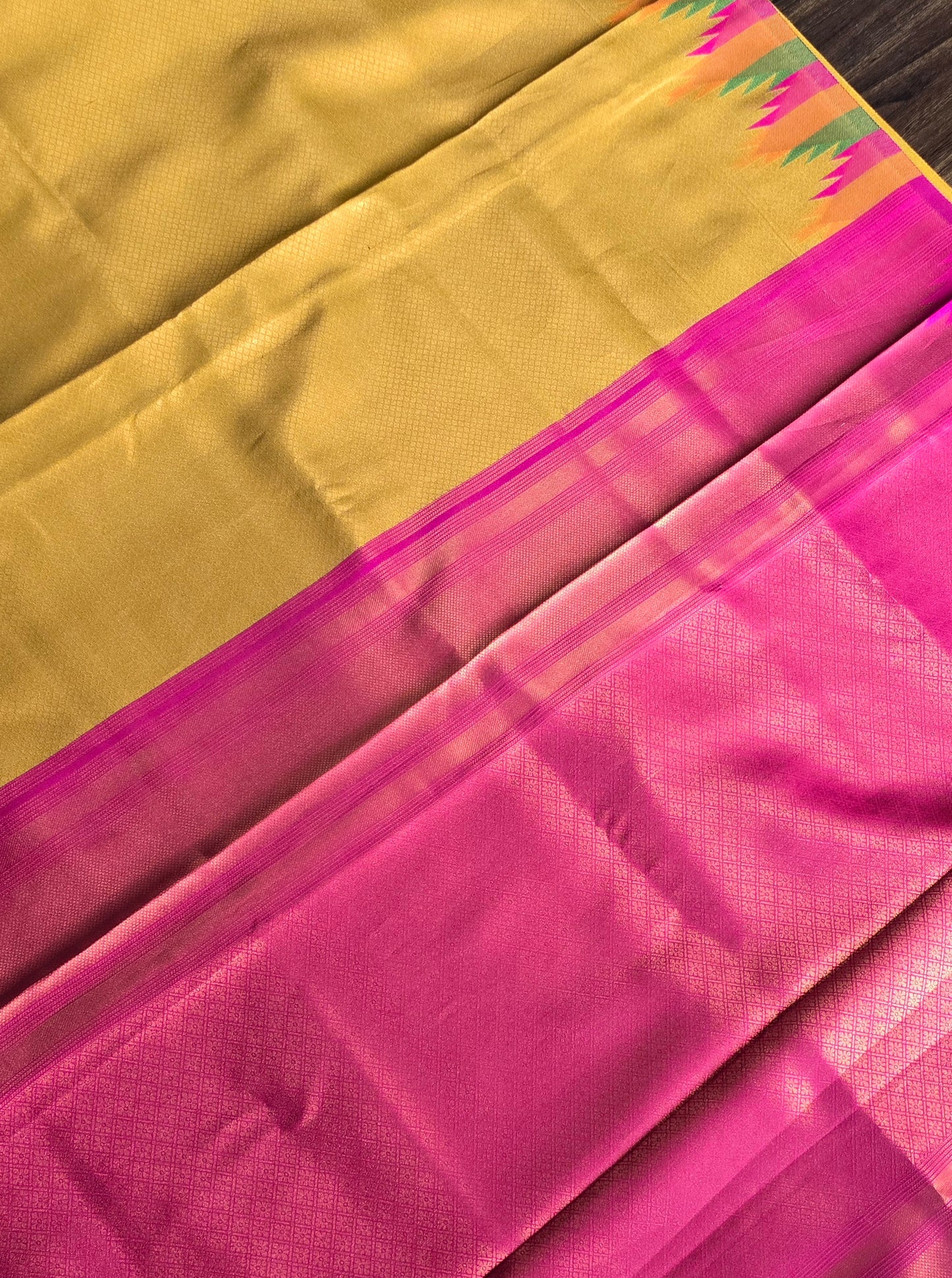 Golden yellow temple border semi silk saree with majenta Jacquard stitched blouse. Code - SAR101