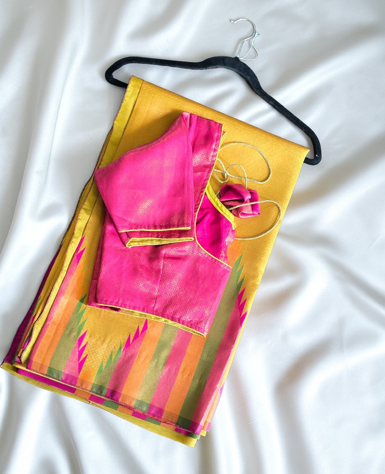 Golden yellow temple border semi silk saree with majenta Jacquard stitched blouse. Code - SAR101