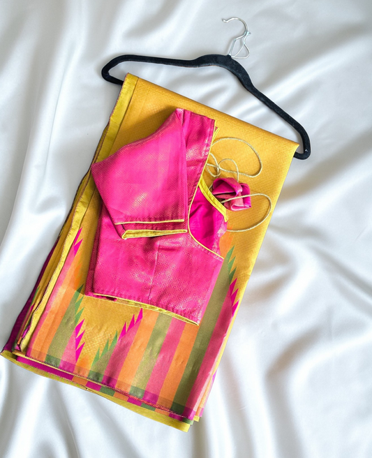 Golden yellow temple border semi silk saree with majenta Jacquard stitched blouse. Code - SAR101
