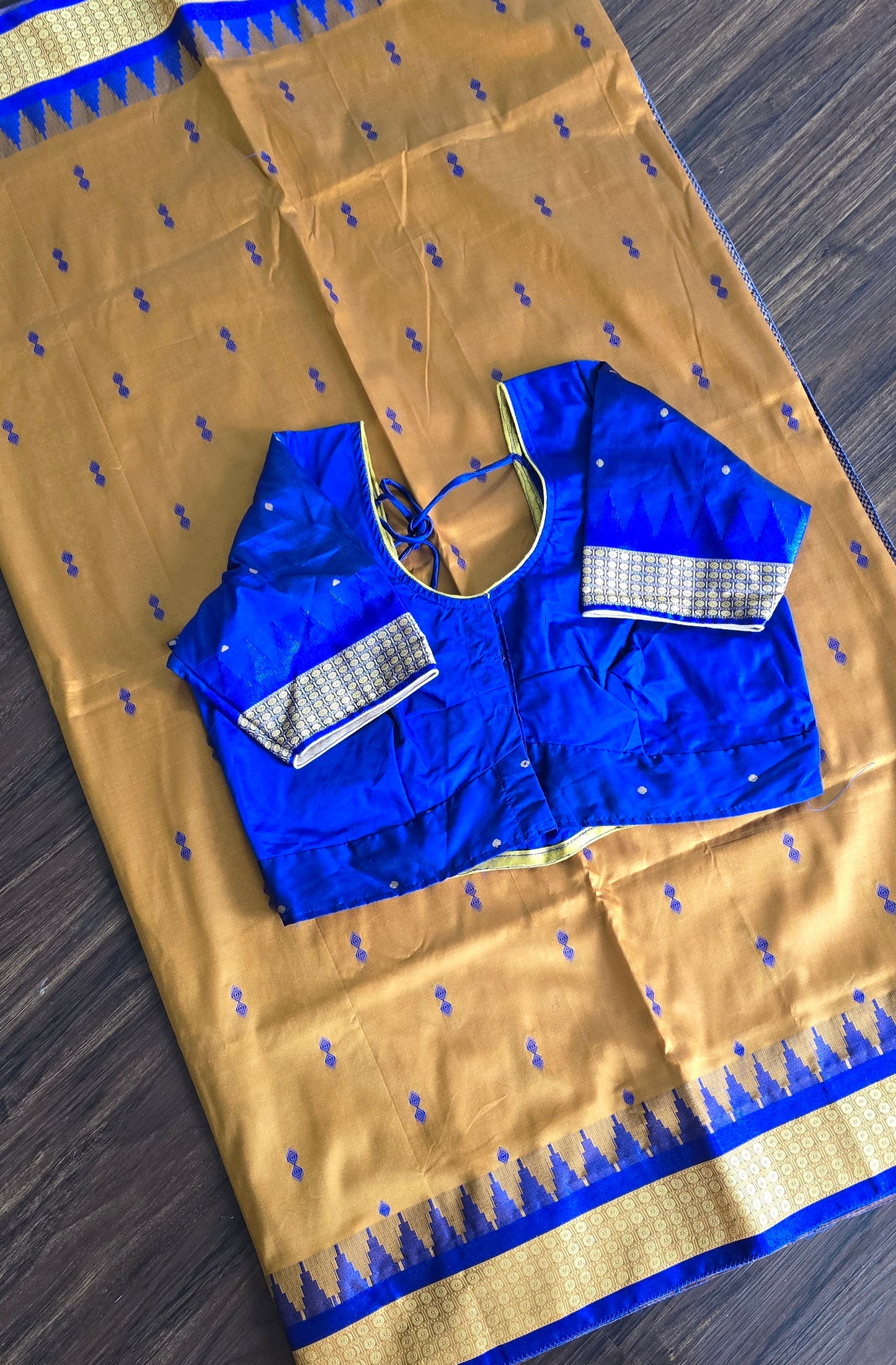 Mustard/turmeric yellow Sambalpuri Bomkai silk saree with royal blue stitched blouse. Code - SAR103